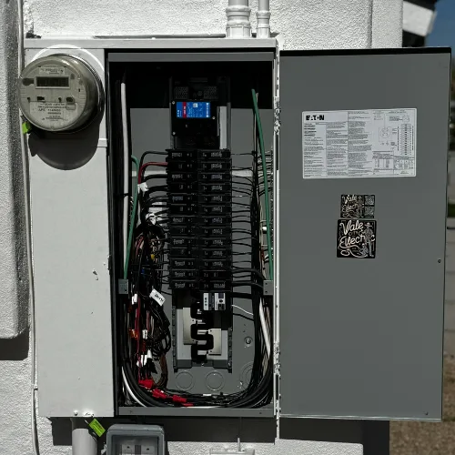 Interior view of 200 amp main panel upgrade in Scottsdale Arizona by Vale City Electric with clean wiring, labeled circuits, and branded stickers